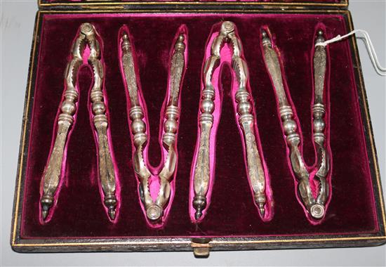 A Victorian cased set of four plated nutcrackers.